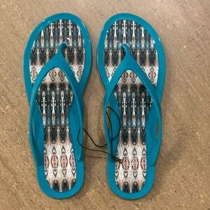 New with tags. Green/teal Nicole Miller flip flop sandals, size 9.